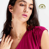 Woman wearing gold jewelry from the on a roll collection by minrl