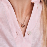 minrl aura necklace gold red worn