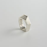 minrl random polygons rings hexagons silver stacked front