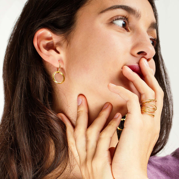 minrl rings earrings yellow gold worn