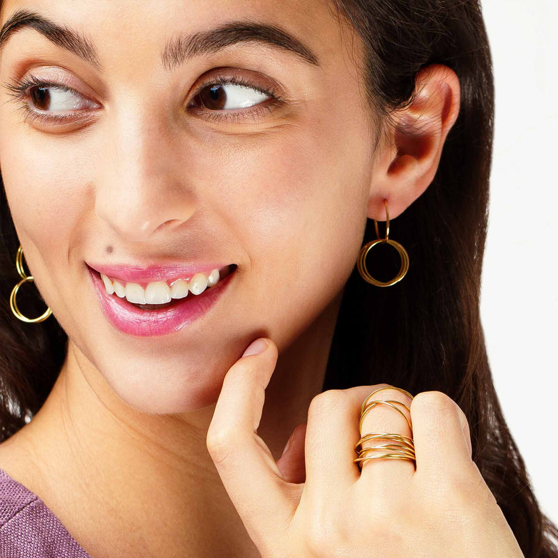 minrl rings earrings yellow gold worn