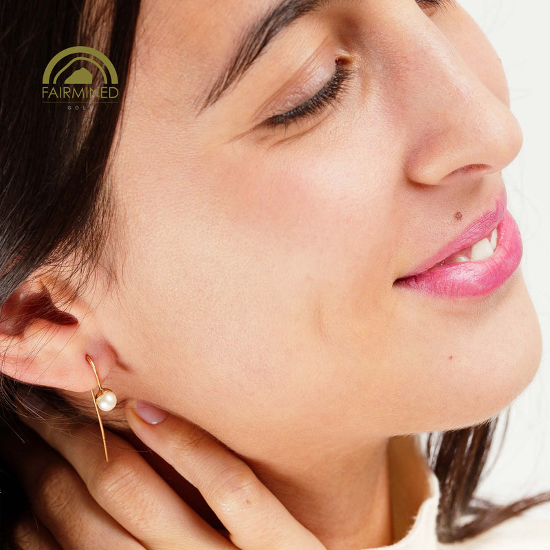 minrl snowdrop long earrings fairmined gold worn