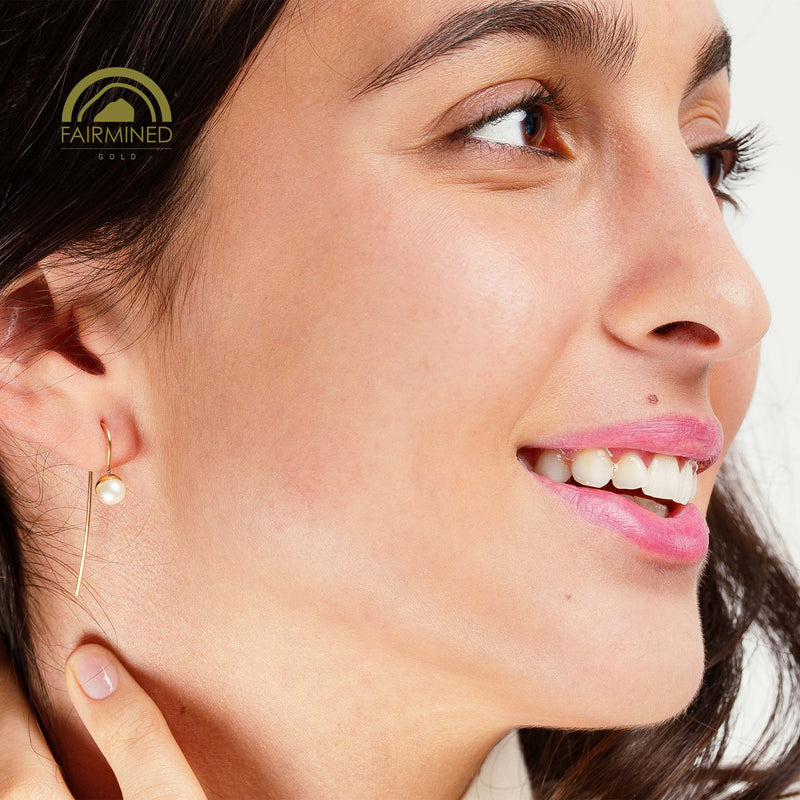 minrl snowdrop long earrings fairmined gold worn